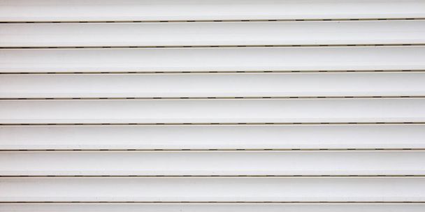 Light white curtain backdrop close-up modern plastic shutter blinds in office room home plastic panels texture background - Photo, Image