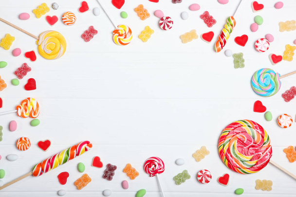 Candies and sweets on a light background, top view with place for text. - Foto, Bild