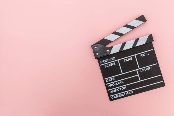 Filmmaker profession. Classic director empty film making clapperboard or movie slate isolated on pink background. Video production film cinema industry concept. Flat lay top view copy space mock up - Valokuva, kuva
