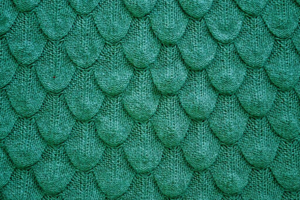 Realistische gebreide textuur close-up in het groen. Fashionable cconcept. - Foto, afbeelding