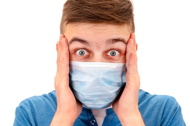 Shocked Young Man in a Flu Mask Isolated on the White Background closeup - Foto, Imagen
