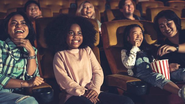 People audience watching movie in the movie theater cinema. Group recreation activity and entertainment concept. - Foto, Imagen