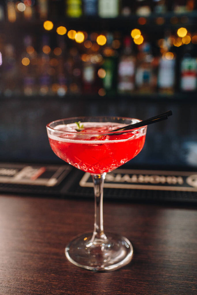 drink in a cocktail glass on bar background - Fotoğraf, Görsel