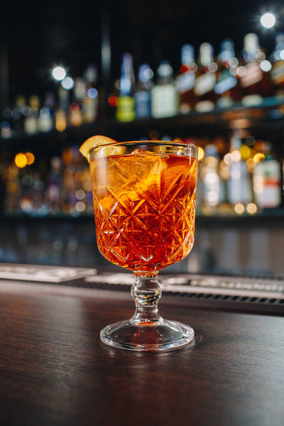 drink in a cocktail glass on bar background - Fotó, kép