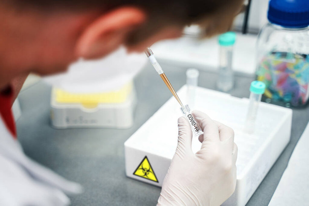 Production of a coronavirus vaccine, Laboratory worker during COVID-19 drug testing - Zdjęcie, obraz