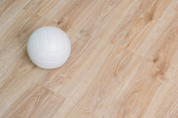 Close Up Of Volleyball Ball On Wooden Floor.  - Zdjęcie, obraz