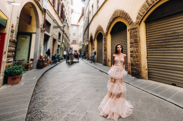 beautiful girl model in pink wedding dress photographed in Florence, photo shoot in Florence bride - Fotó, kép