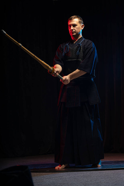 portrait of caucasian man kendo fighter with bokuto - Foto, Imagen