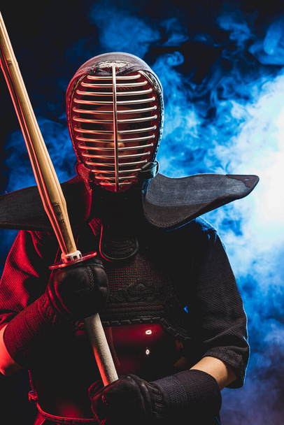 young kendo fighter in armor practicing with bamboo sword - Foto, Imagem