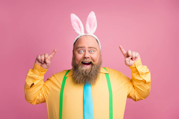 Close-up portrait of his he nice amazed cheerful cheery funky glad bearded guy showing wearing bunny ears having fun isolated over pink pastel color background - Fotoğraf, Görsel
