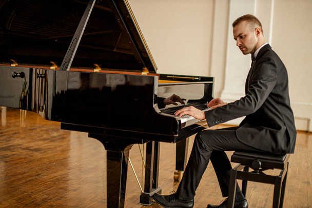 young talented male professionally play piano - Φωτογραφία, εικόνα