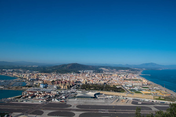 Gibraltar, United Kingdom, February 20, 2020:-The town of Gibraltar viewed from up the Rock. Gibraltar is a British Overseas Territory located on the southern tip of Spain. - Photo, Image