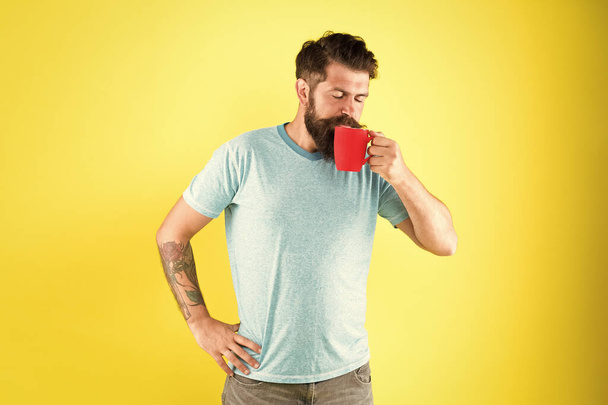his perfect breakfast. Water balance and health care. Bearded man enjoy morning routine. sip of energy. brutal hipster drink beverage. hot drink mug. man casual style drink tea. good morning coffee - Photo, image
