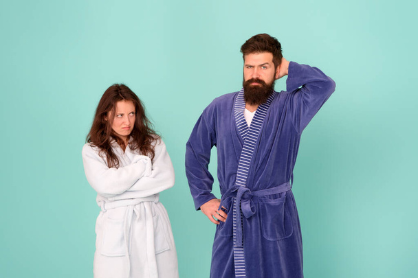 Divorce. Unhappy couple in love blue background. Sexy woman and bearded man in home clothing. Conflict between wife and husband. Family conflict. Relationship conflict. Conflict and conflicting - Foto, Imagen