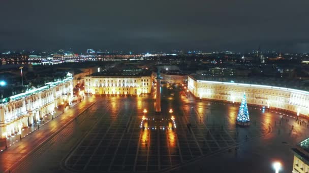 Aerial view to Palace square with Winter Palace and Alexander Column in background, St Petersburg, Russia - Materiał filmowy, wideo