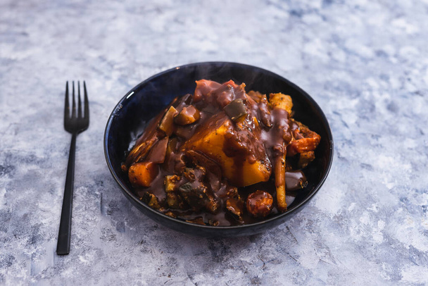 healthy plant-based food recipes concept, butternut pumpkin zucchini and parsnip roast with vegan mushroom gravy - Photo, Image