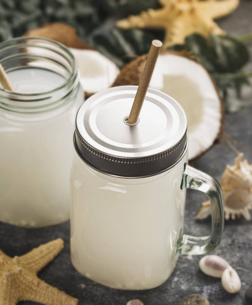 Coconut milk drink in glass jar with handle - Photo, Image