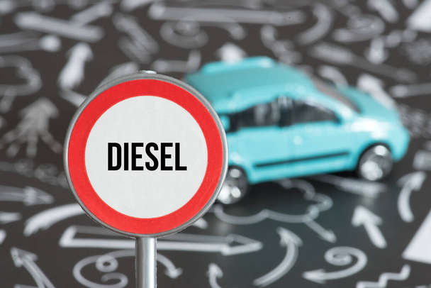 A car and a traffic sign indicating diesel driving ban - Valokuva, kuva