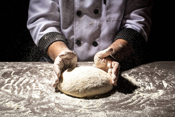 pizza prepare dough hand topping. chef prepares the dough with flour. - Photo, Image