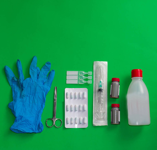 a hygienic gloves, medicines and alcohol - Fotoğraf, Görsel