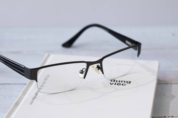 Reading glasses and book - Photo, Image