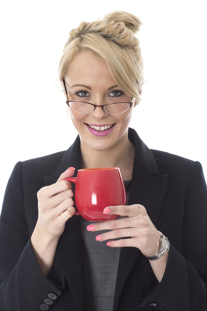 Young Business Woman Drinking a Mug of Tea - 写真・画像