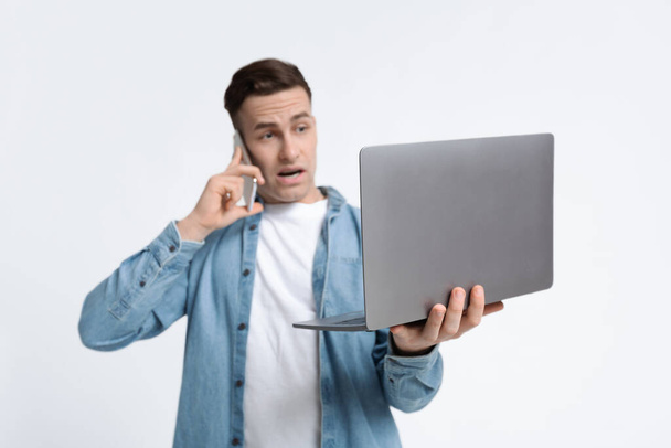 Focus on laptop in hands of guy - Photo, Image