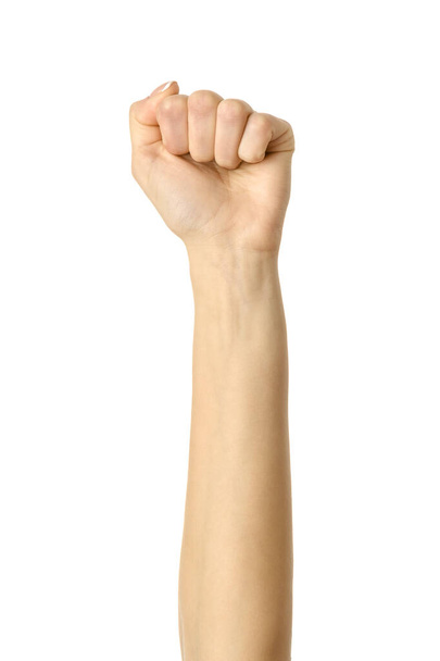 Hand clenched in a fist. Vertical image. Woman hand with french manicure gesturing isolated on white background. Part of series - Foto, afbeelding