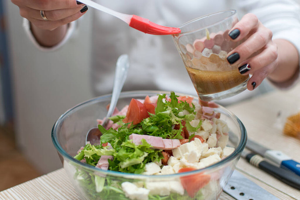Fresh vegetable salad add sauce. - Photo, Image