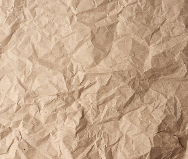 hoja en blanco arrugado de papel kraft envoltura marrón, textura vintage para el diseñador, marco completo - Foto, Imagen