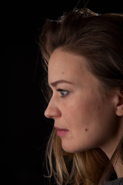 Woman on black background close up profile head shot - Fotografie, Obrázek