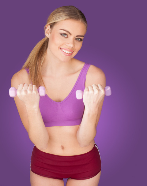 attractive woman exercising with dumbbell - Photo, Image
