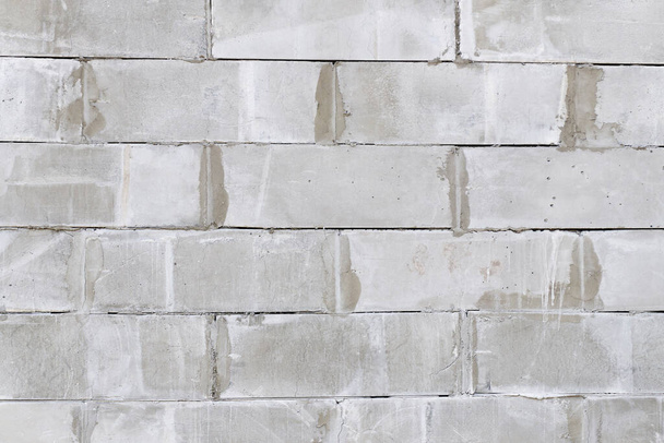 Brick wall made of foam concrete blocks. Concrete block wall seamless background and texture. - Foto, afbeelding