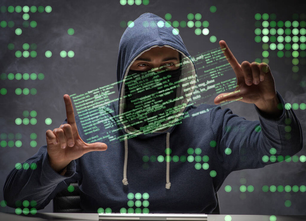 Young hacker in data security concept - Photo, Image