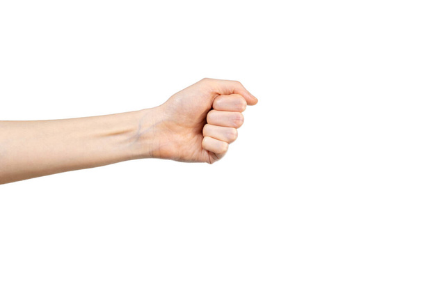Caucasiana punho cerrado feminino no fundo branco. Um gesto de mão. Conceito de gesticulação
. - Foto, Imagem