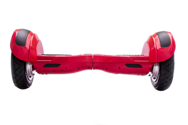 Önegyensúlyozó kétkerekű tábla vagy légpárnás robogó fehér háttérrel. Gyroboard: piros gipszkarton fehér háttérrel. Új mozgás - Fotó, kép