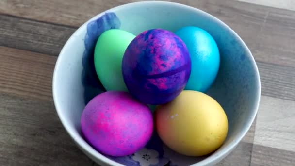 Somebody takes Easter egg from bowl with his hand - Video