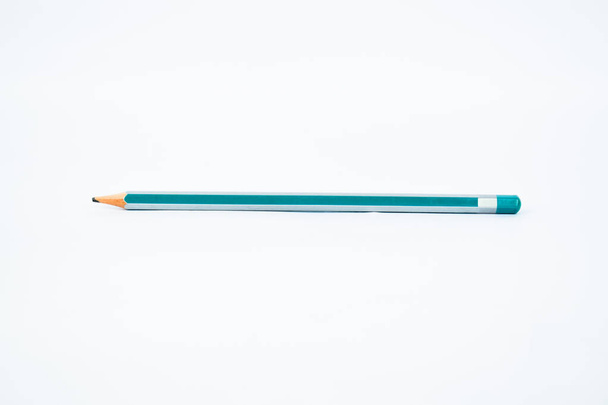 Single light blue and silver colored sharp wood pencil crayon nicely displayed on a white background - Photo, Image