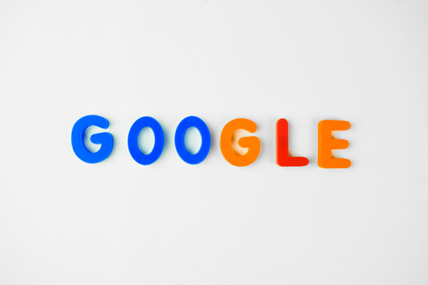 GOOGLE written in different colored letter blocks on an isolated white background - Photo, Image