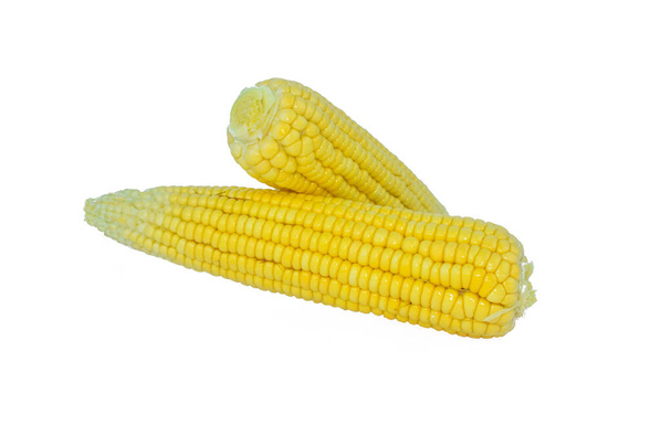 Vista lateral de dos maíz dulce de color amarillo aislado sobre un fondo blanco vacío
 - Foto, imagen