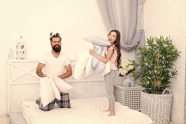 Give affection and support. Sincere emotions. Pajamas party. Happy childhood. Upbringing happy daughter. Happy family. Role of father. Pillow fight. Dad seek live life of integrity and honesty - Fotoğraf, Görsel