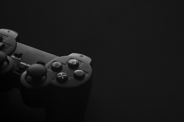 Black and white photo of the gamepad, there is a place for text. - Фото, изображение