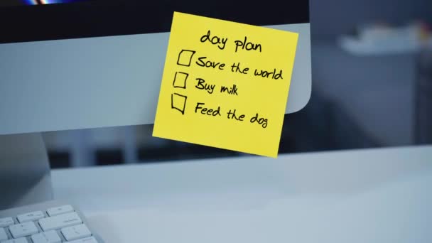 Day plan. The inscription on the sticker on the monitor. Message. Motivation. Reminder. Handwritten text written with a marker. Color sticker. A message for an employee, a colleague. Work remotely. - Footage, Video