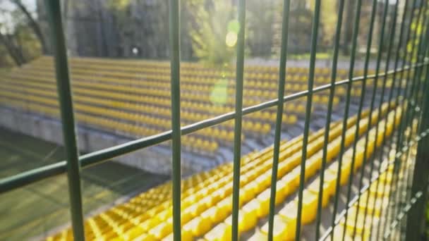 The stadium is fenced with an iron fence. World Cup and European Football Championship canceled. Cancellation of matches due to the coronavirus pandemic, quarantine. Access is closed. - Footage, Video
