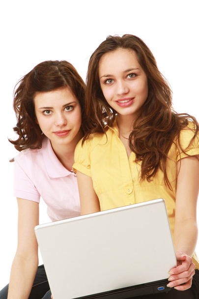 Young girls with a laptop - Фото, изображение