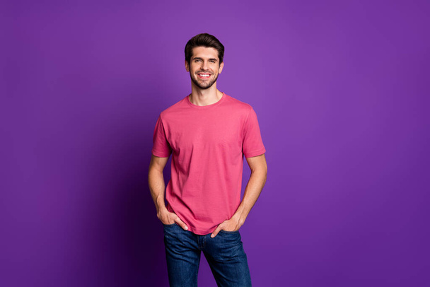 Portrait of content candid guy enjoy spring free time weekend holiday put hands pocket wear stylish outfit isolated over vibrant color background - Fotografie, Obrázek