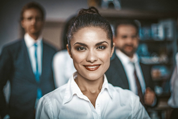 Beautiful Woman In White Blouse Smiles In Office - Zdjęcie, obraz