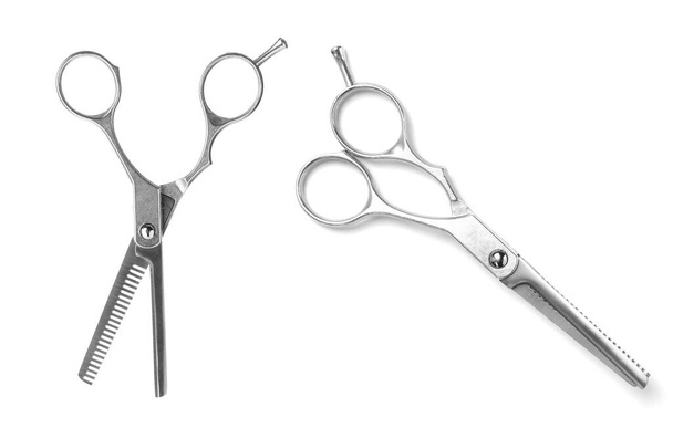 New thinning scissors on white background. Professional hairdresser tool - Photo, image