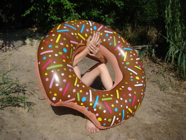 inflatable circle in the form of a doughnut for entertainment on the water - Photo, Image