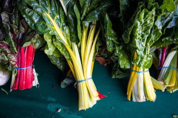 Bunches of Rainbow Chard at Farmers Market in California - Foto, immagini